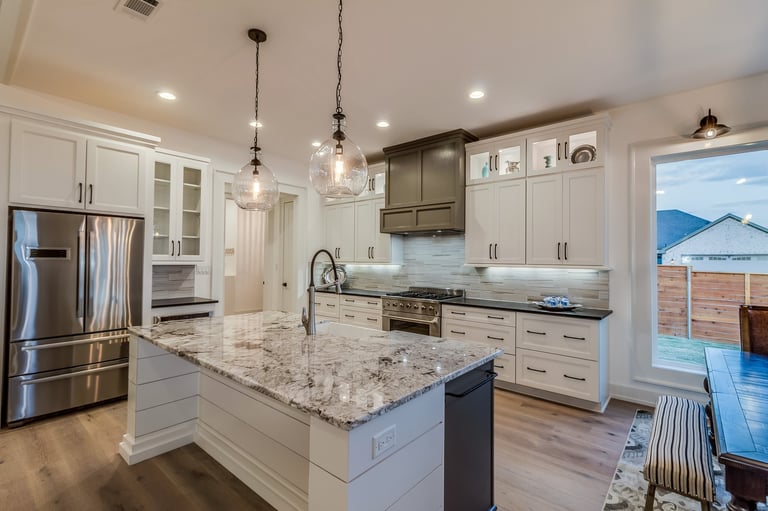 Large appliances and white cabinets in new kitchen