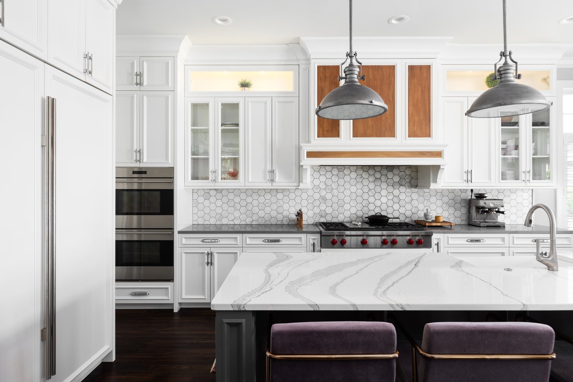 Modern luxury kitchen with marble island and elegant pendant lighting