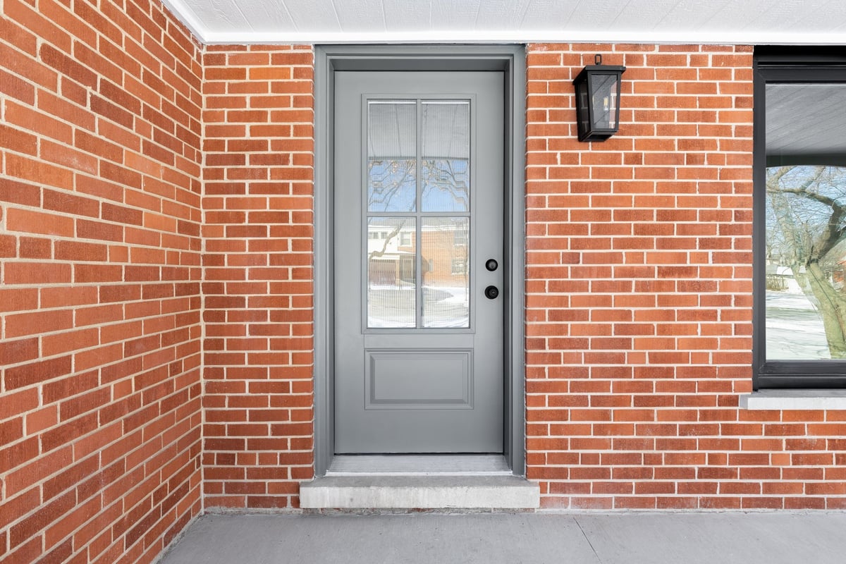 Luxury home exterior with brick and stone finishes